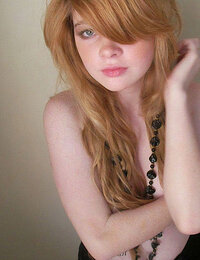 Tender teen with long red wavy hair
